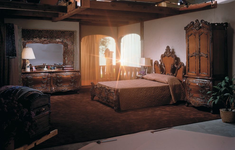 Photo of a large traditional master bedroom in Chicago with white walls, carpet, brown floor and no fireplace.