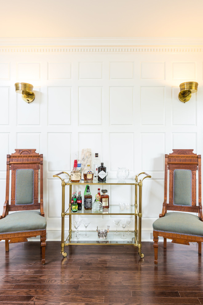 Photo of a large traditional bar cart in Cedar Rapids with no sink and dark hardwood floors.