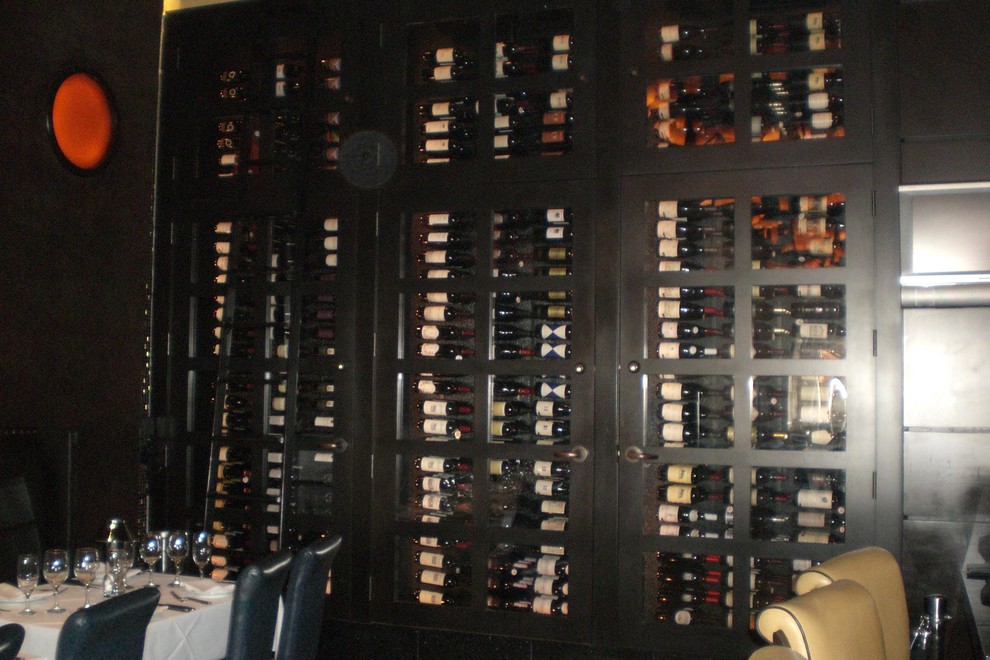 Design ideas for a large contemporary wine cellar in Phoenix with display racks.