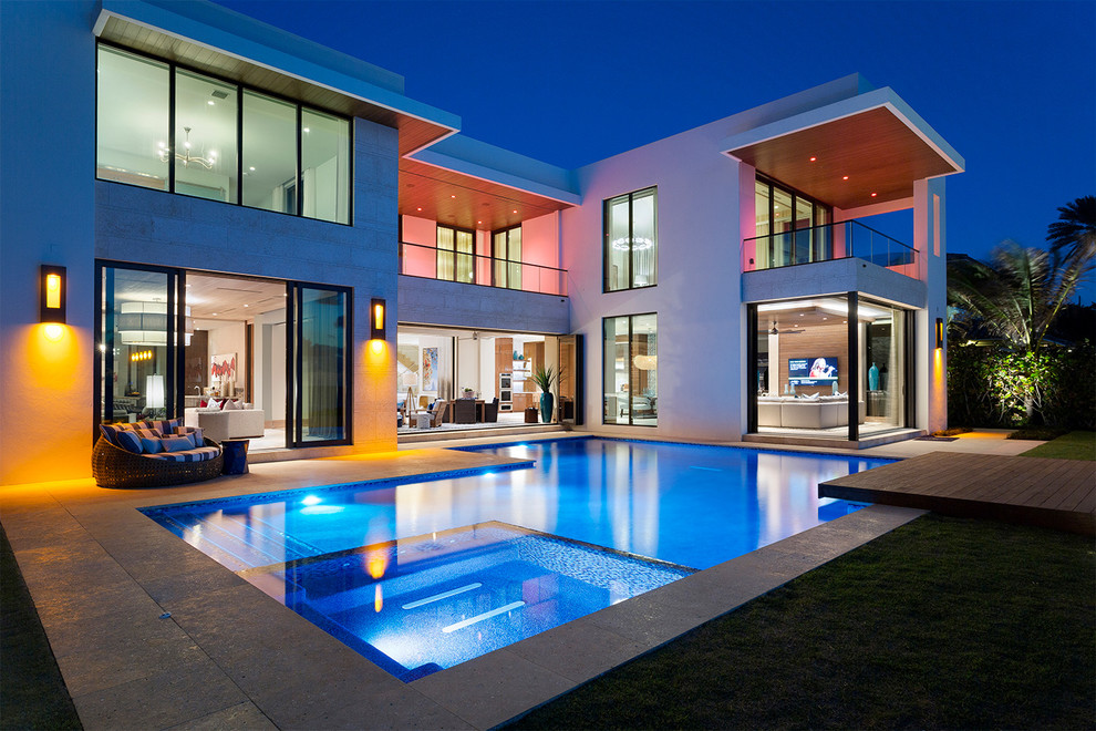 Inspiration for a contemporary backyard custom-shaped lap pool in Miami.