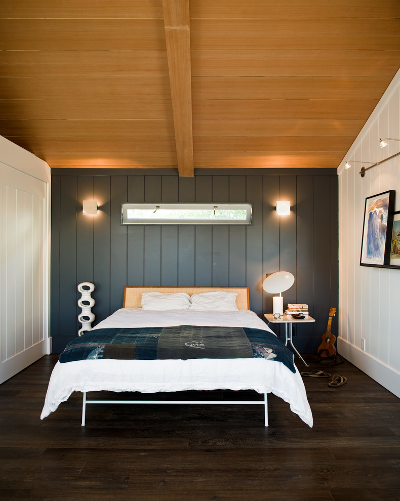 Design ideas for a contemporary bedroom in Los Angeles with black walls and dark hardwood floors.