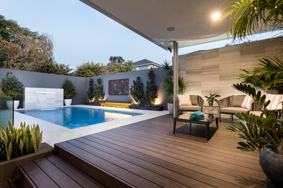 Design ideas for an expansive contemporary backyard patio in Perth with decking and a pergola.
