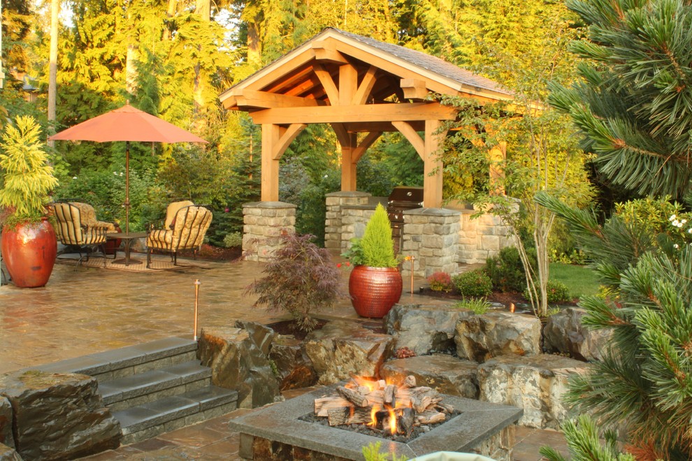 Traditional patio in Seattle with a pergola.