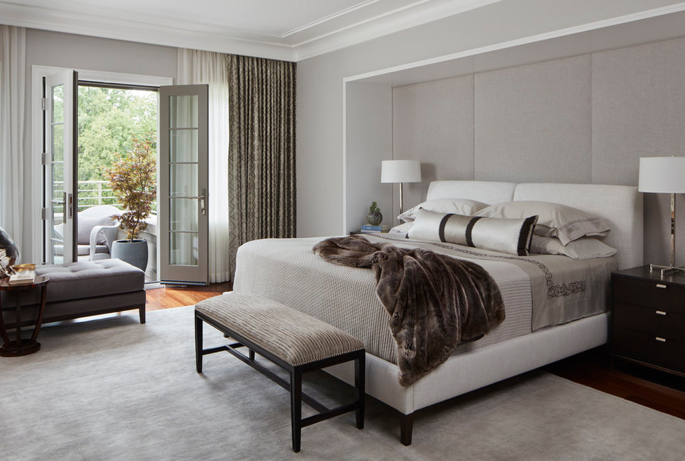 Inspiration for a transitional bedroom in Chicago with grey walls, dark hardwood floors and brown floor.
