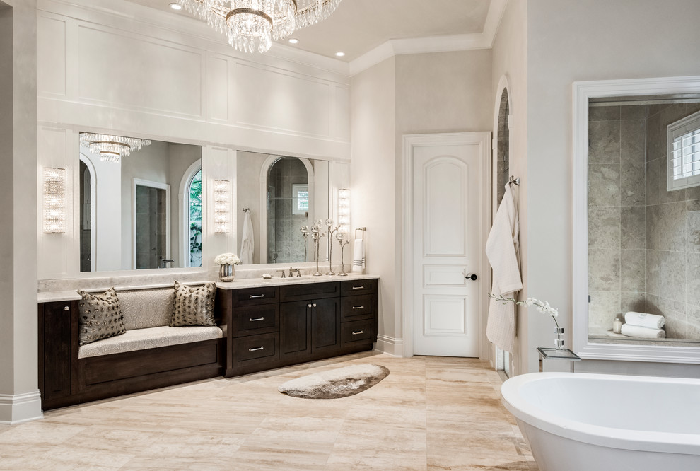 Design ideas for a large transitional master bathroom in Miami with raised-panel cabinets, dark wood cabinets, a freestanding tub, a double shower, a two-piece toilet, multi-coloured tile, stone tile, beige walls, porcelain floors, an undermount sink, marble benchtops, multi-coloured floor and a hinged shower door.