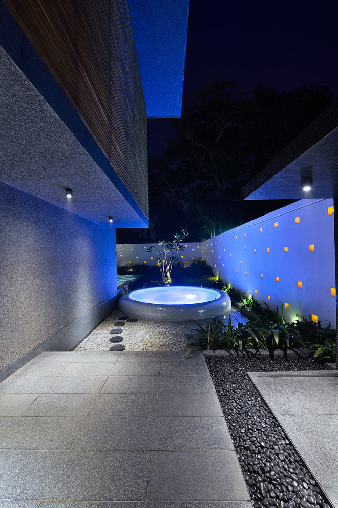 Inspiration for a large contemporary garden in Kolkata with with pond.