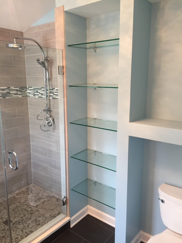 This is an example of a small traditional master bathroom in Baltimore with flat-panel cabinets, grey cabinets, an alcove shower, gray tile, porcelain tile, blue walls, porcelain floors, an undermount sink, engineered quartz benchtops, black floor, a hinged shower door and white benchtops.