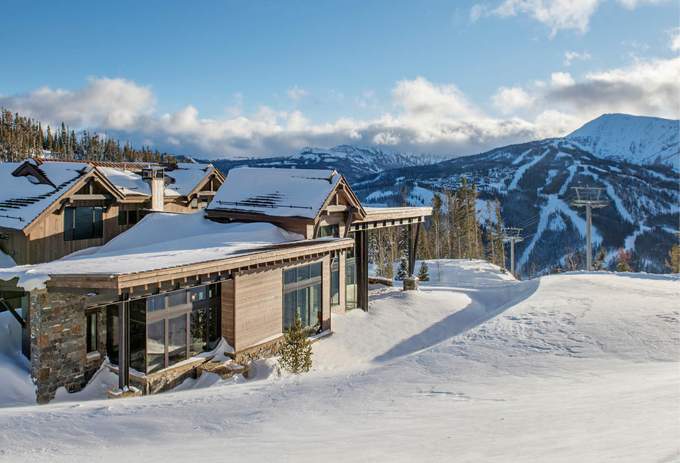 Mountain Peek - Mountain Peek is a custom residence located within the Yellowstone Club in Big Sky, Montana. The layout of the home was heavily influenced by the site. Instead of building up vertically the floor plan reaches out horizontally with slight elevations between different spaces. This allowed for beautiful views from every space and also gave us the ability to play with roof heights for each individual space. Natural stone and rustic wood are accented by steal beams and metal work throughout the home.

(photos by Whitney Kamman)