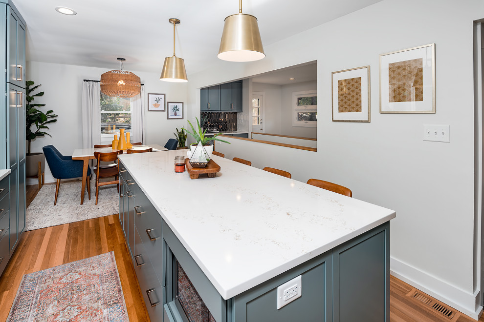 Eat-in kitchen - large mid-century modern l-shaped eat-in kitchen idea in Charlotte with an undermount sink, shaker cabinets, turquoise cabinets, marble countertops, white backsplash, stainless steel appliances and an island