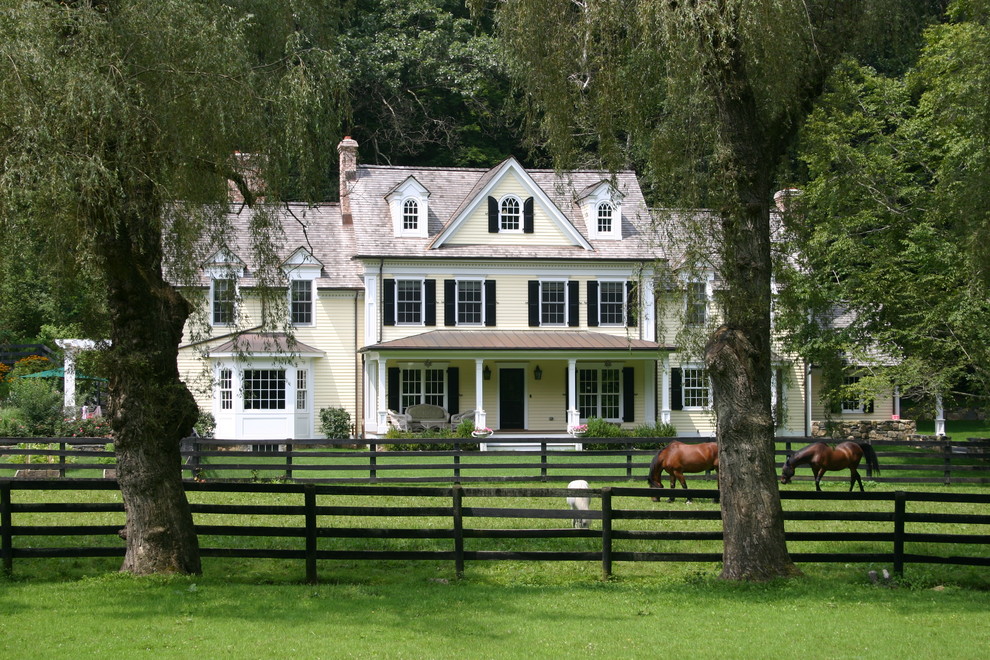 Country exterior in New York with wood siding.