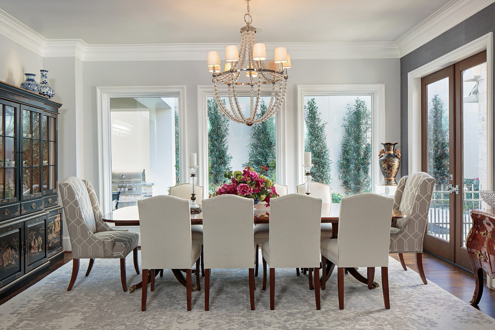 Photo of a traditional dining room in Houston with grey walls and no fireplace.