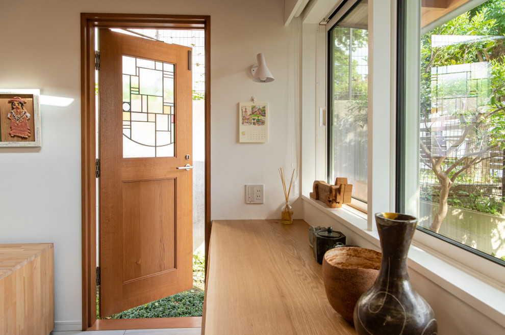 Inspiration for a small craftsman plywood floor and beige floor sunroom remodel in Tokyo with no fireplace and a skylight