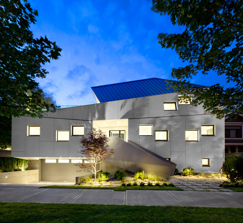 Design ideas for a large contemporary three-storey white exterior in Vancouver.