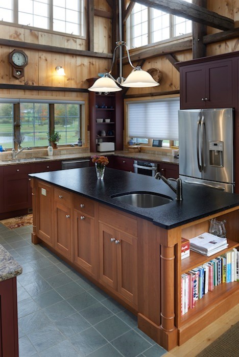 Photo of a mid-sized country u-shaped eat-in kitchen in Bridgeport with an undermount sink, shaker cabinets, dark wood cabinets, granite benchtops, beige splashback, cement tile splashback, stainless steel appliances, ceramic floors and with island.