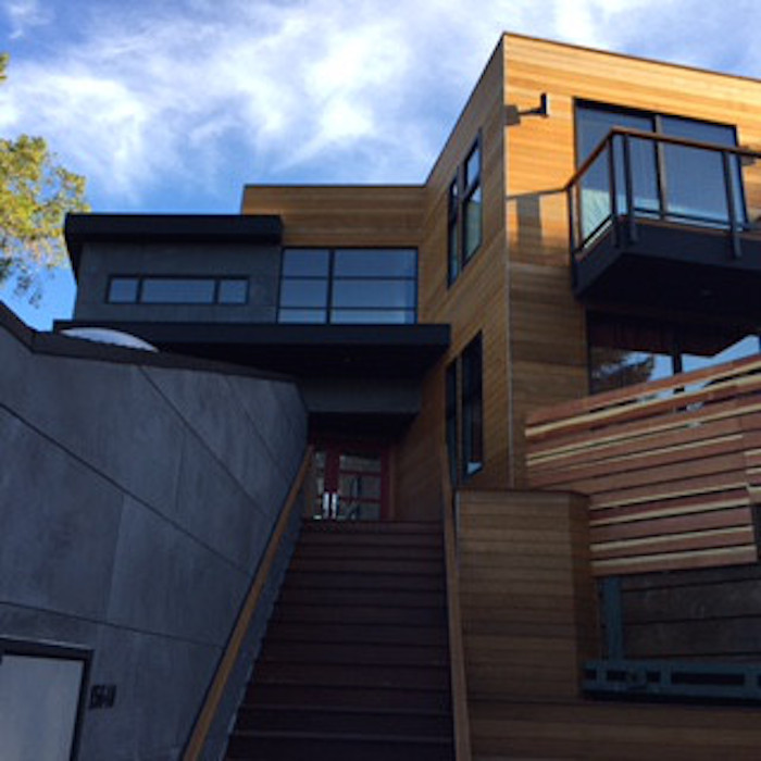 Photo of a large modern split-level brown exterior in San Francisco with wood siding and a flat roof.