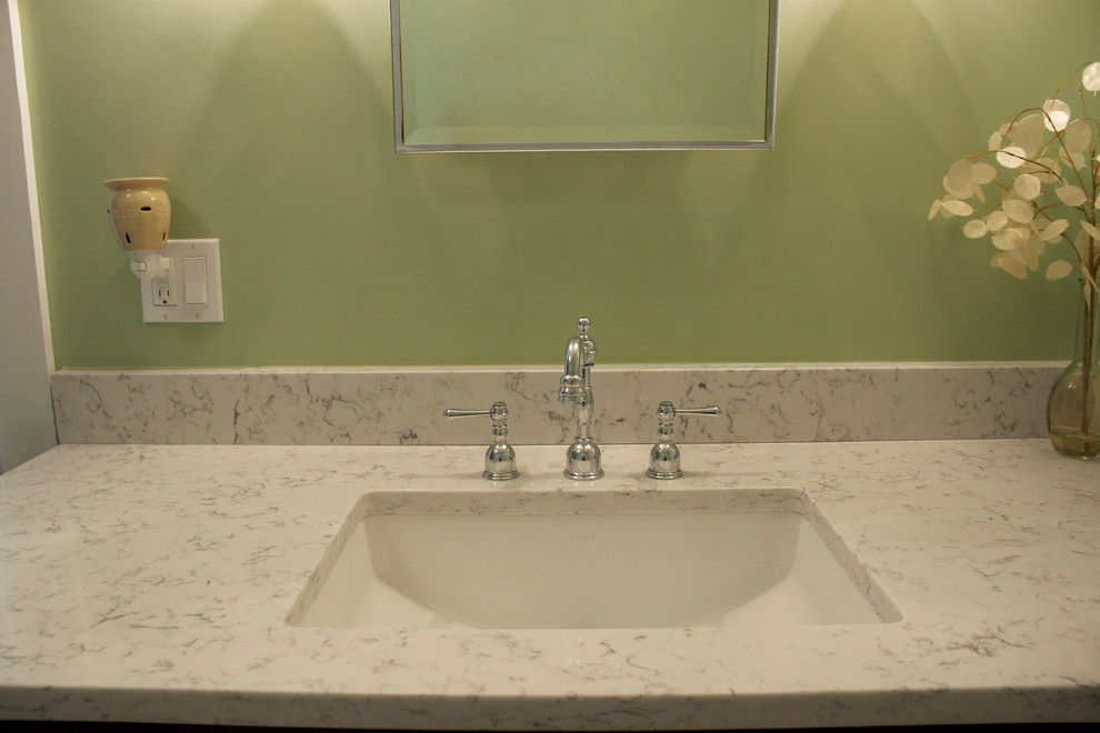 Inspiration for a mid-sized transitional medium tone wood floor bathroom remodel in Boston with an undermount sink, shaker cabinets, dark wood cabinets, quartz countertops, a two-piece toilet and green walls