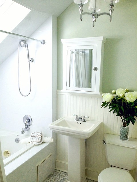 small green and white master bathroom with carrara marble floor