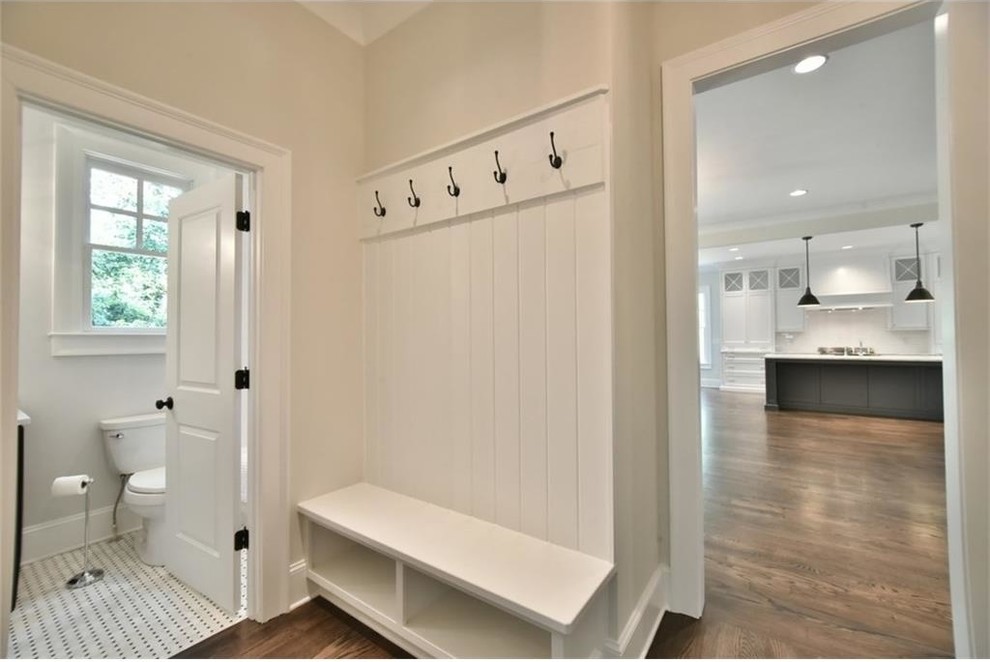 Hallway - transitional medium tone wood floor hallway idea in Atlanta with gray walls