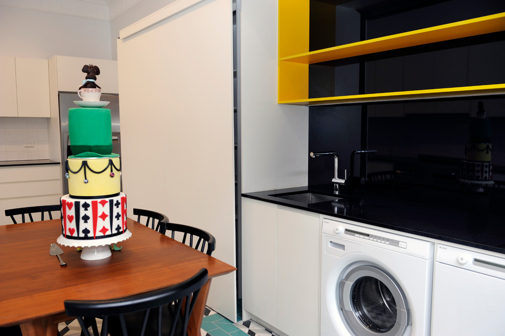 This is an example of a transitional laundry room in Melbourne.