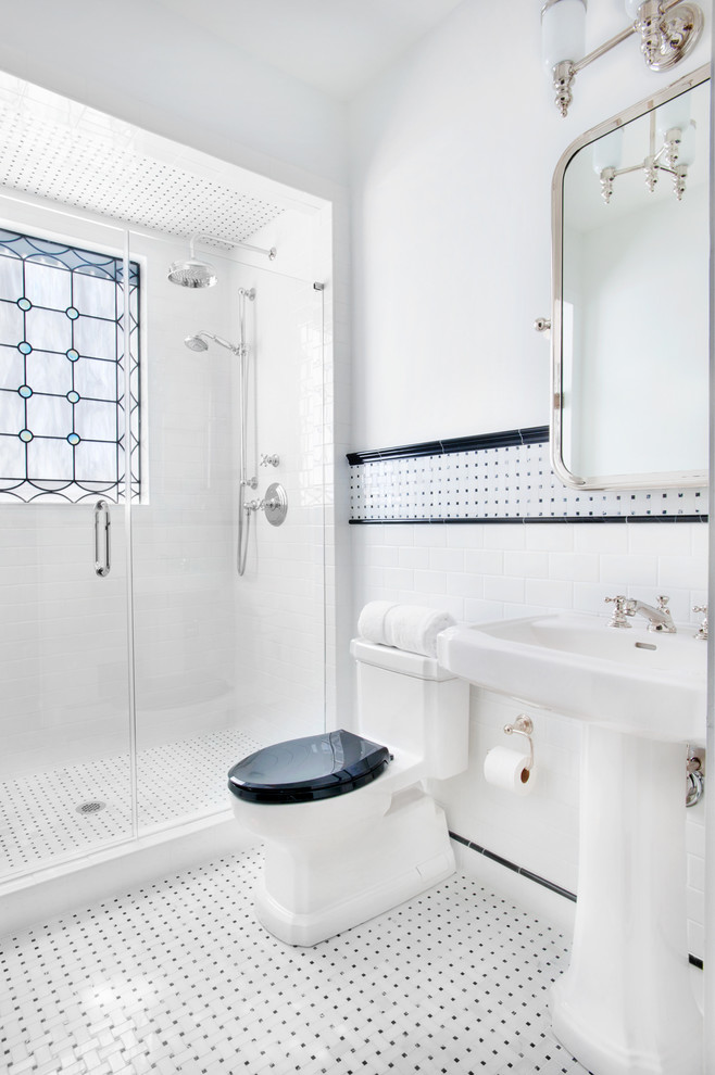 Photo of a large traditional 3/4 bathroom in Other with an alcove shower, a two-piece toilet, black and white tile, subway tile, white walls, mosaic tile floors, a pedestal sink, multi-coloured floor, a hinged shower door and a single vanity.