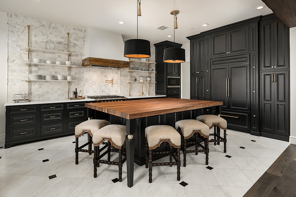 Example of a huge minimalist u-shaped medium tone wood floor and brown floor enclosed kitchen design in Phoenix with an undermount sink, raised-panel cabinets, quartzite countertops, multicolored backsplash, ceramic backsplash, paneled appliances, an island, multicolored countertops and black cabinets