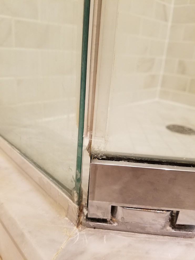 Frameless shower door gap by hinge please help