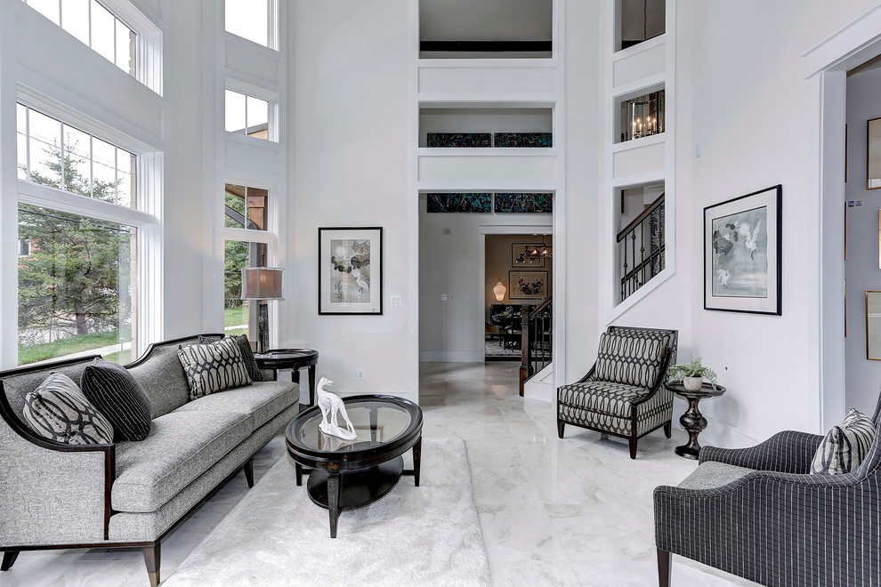 This is an example of a mid-sized transitional formal enclosed living room in DC Metro with white walls, no tv and marble floors.
