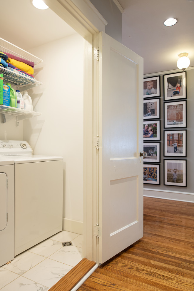 Design ideas for an eclectic laundry cupboard in Kansas City with a side-by-side washer and dryer.