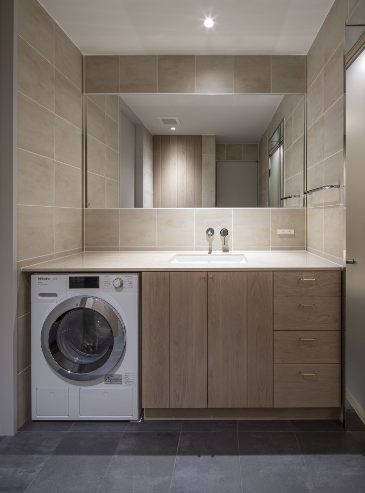 Design ideas for a medium sized modern cloakroom in Nagoya with freestanding cabinets, light wood cabinets, beige tiles, ceramic tiles, beige walls, ceramic flooring, a submerged sink, marble worktops, black floors, beige worktops, a built in vanity unit and a timber clad ceiling.