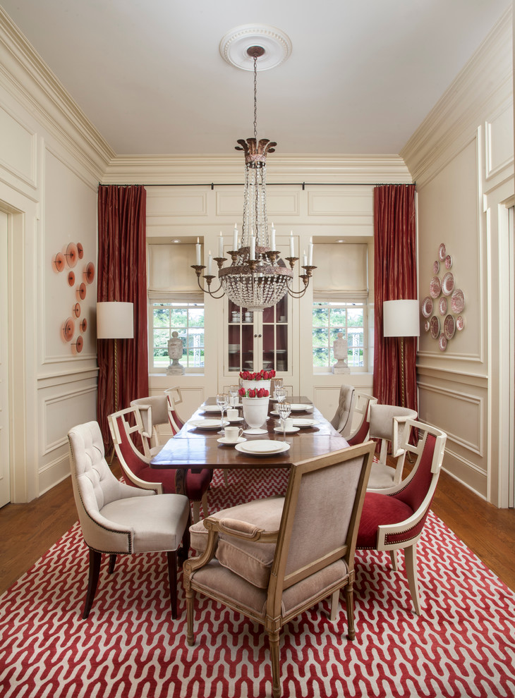 Design ideas for a traditional separate dining room in New Orleans with beige walls and medium hardwood floors.