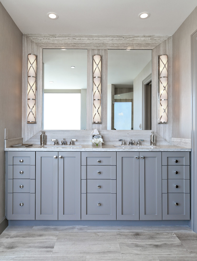 This is an example of a transitional master bathroom in Miami with an undermount sink, shaker cabinets, grey cabinets and grey walls.