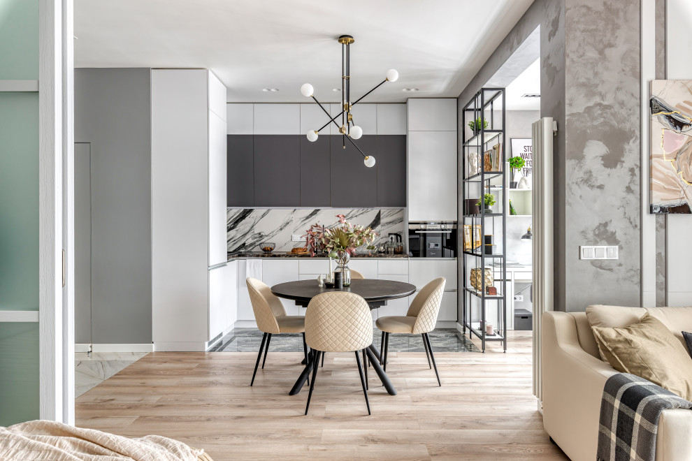 Design ideas for a medium sized scandinavian grey and white single-wall open plan kitchen in Moscow with flat-panel cabinets, porcelain flooring and black floors.