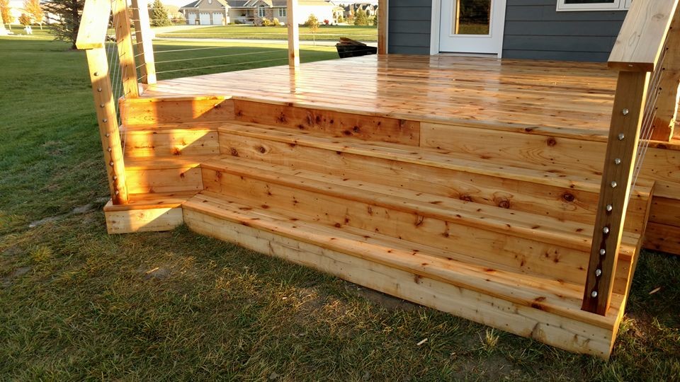 Inspiration for a large rustic deck remodel with a pergola