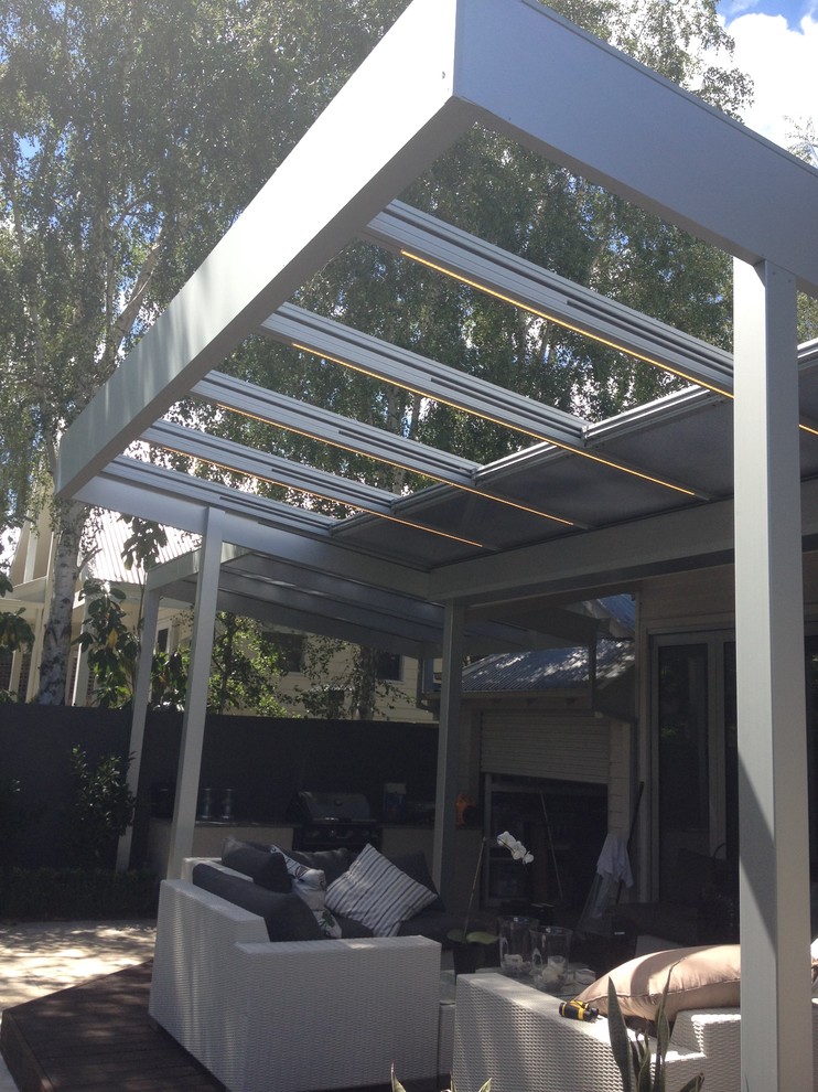 Photo of a contemporary patio in Melbourne with a pergola.