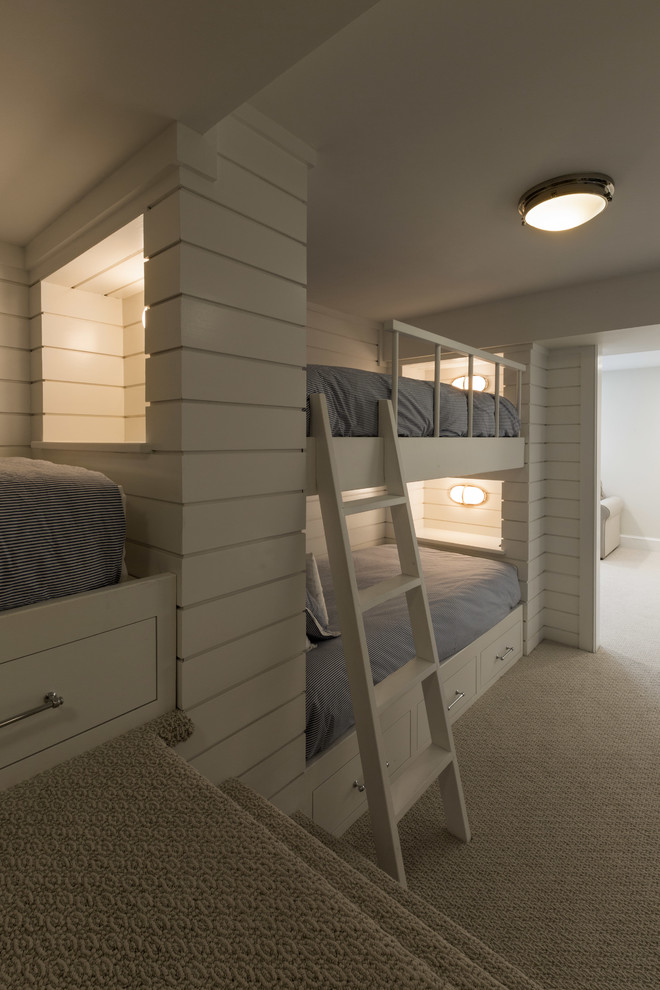 Photo of a mid-sized transitional gender-neutral kids' bedroom for kids 4-10 years old in Burlington with white walls, carpet and beige floor.