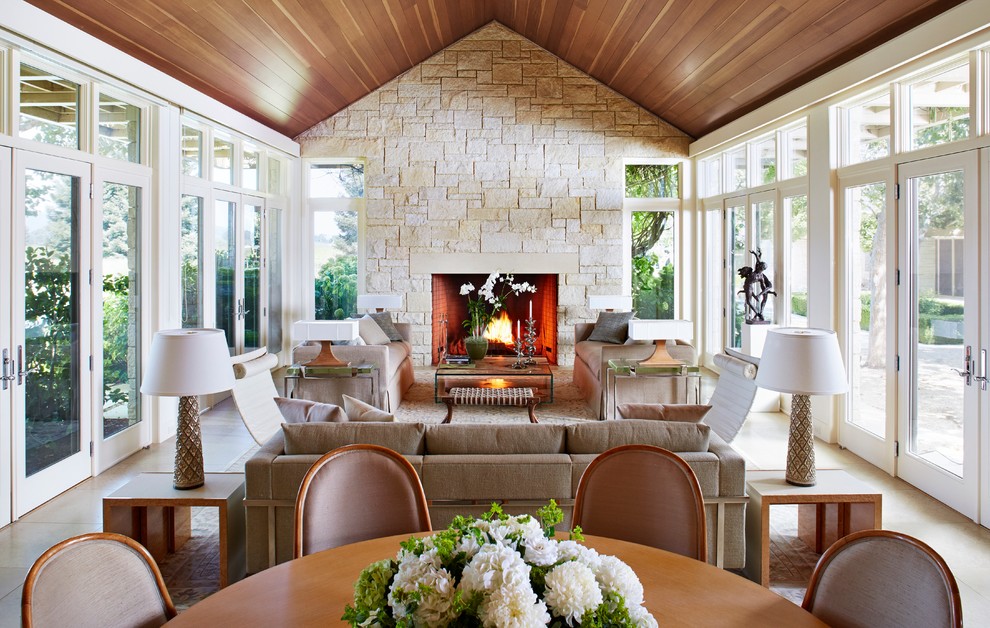 Mid-sized transitional formal and open concept porcelain tile living room photo in San Francisco with beige walls, a standard fireplace, a stone fireplace and no tv