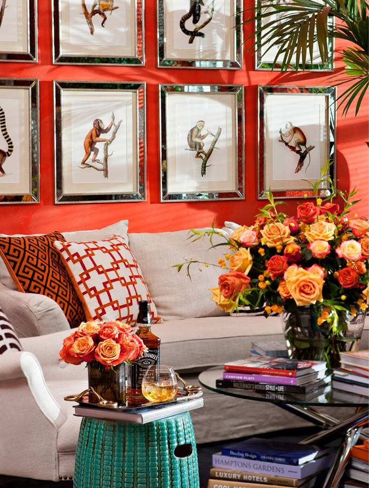 Inspiration for a mid-sized traditional enclosed family room in Miami with orange walls.