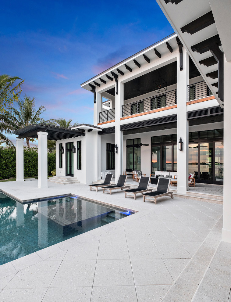 Photo of a large transitional backyard patio in Miami.