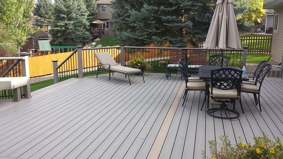 This is an example of a mid-sized traditional backyard deck in Denver with no cover.