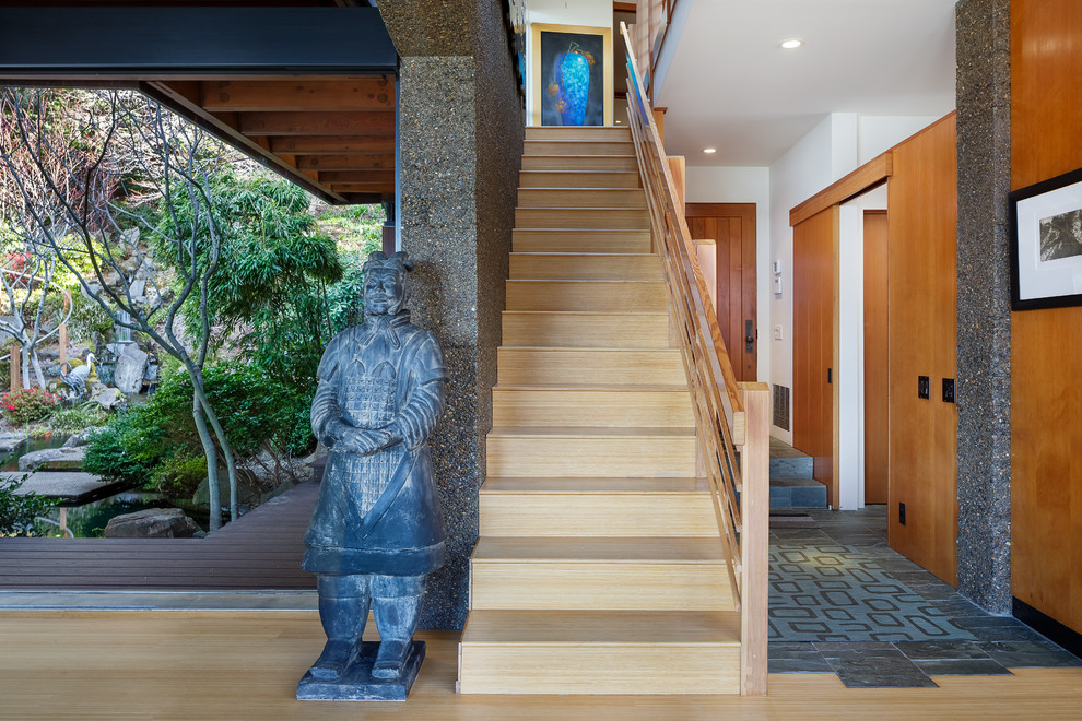 Inspiration for a large asian wood straight staircase in Other with wood risers and wood railing.