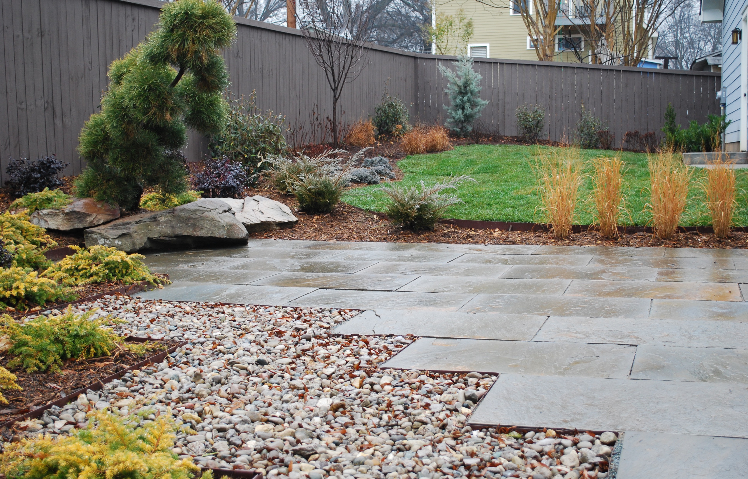 Zigzag patio with cut in boulders.