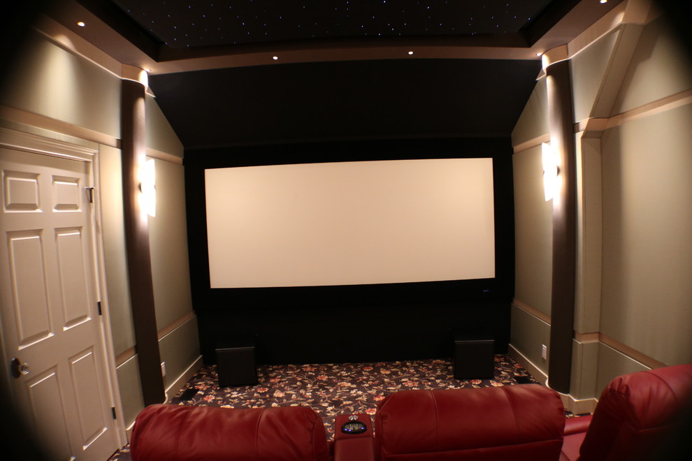 Photo of a small contemporary enclosed home theatre in Boston with green walls, carpet and a projector screen.