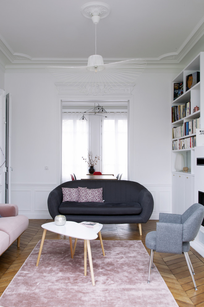 Inspiration for a mid-sized contemporary living room in Paris with a library, white walls, no fireplace and no tv.