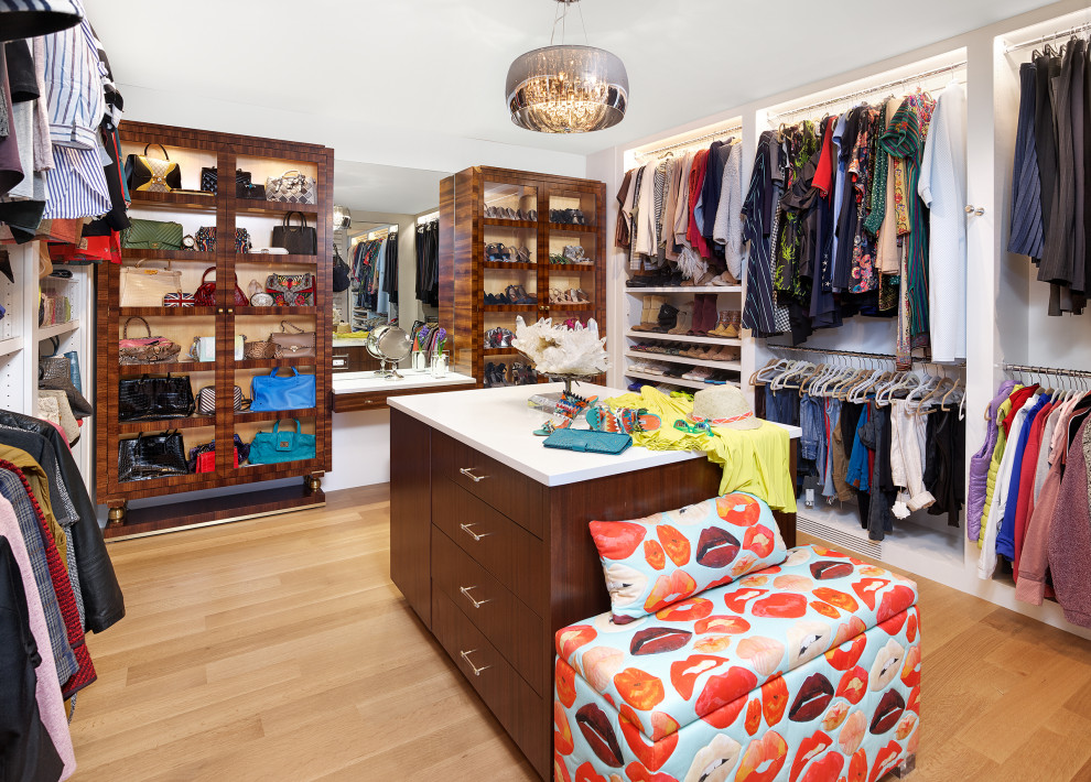 North Dallas - Walk-in closet - large contemporary women's light wood floor and beige floor walk-in closet idea in Dallas with flat-panel cabinets and dark wood cabinets