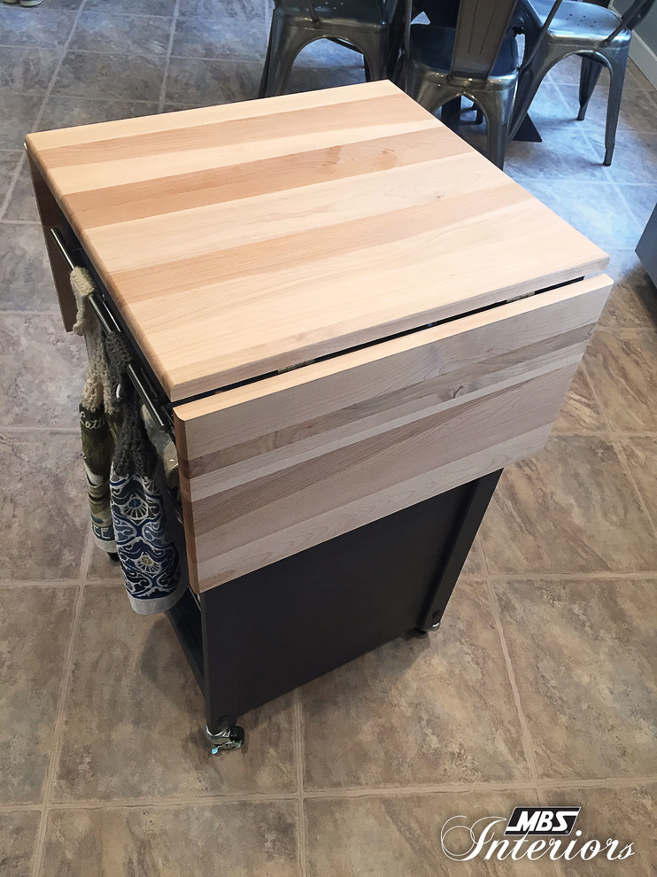 Example of a mid-sized transitional galley ceramic tile and beige floor eat-in kitchen design with a farmhouse sink, white cabinets, stainless steel appliances, shaker cabinets, granite countertops, blue backsplash, glass sheet backsplash and an island