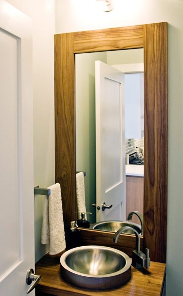 Photo of a mid-sized modern 3/4 bathroom in Calgary with an integrated sink, flat-panel cabinets, medium wood cabinets, wood benchtops, a corner shower, a one-piece toilet and grey walls.