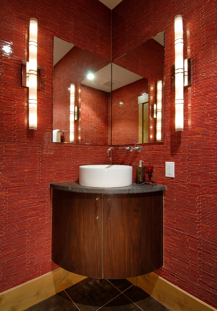 Design ideas for a contemporary powder room in Denver with a vessel sink, flat-panel cabinets, dark wood cabinets and red tile.