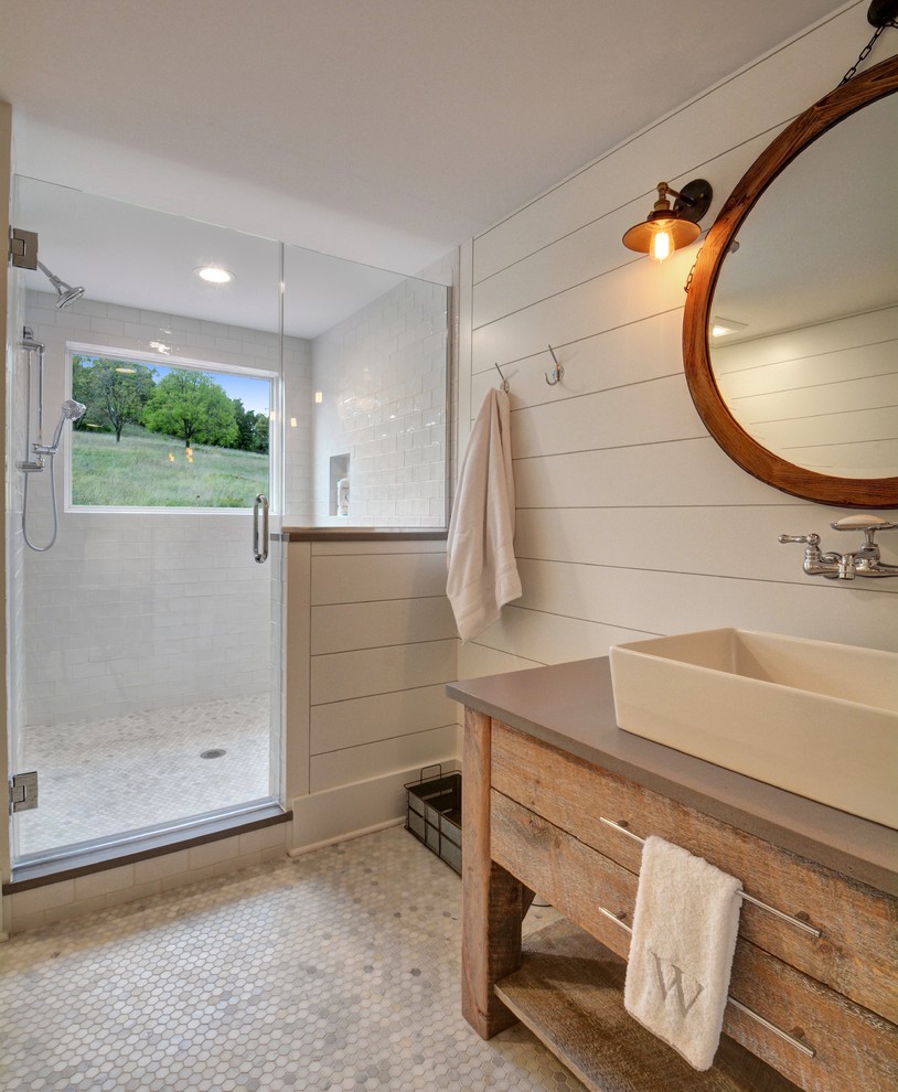 Inspiration for a country 3/4 bathroom in Chicago with medium wood cabinets, an alcove shower, white tile, subway tile, white walls, mosaic tile floors, a vessel sink, grey floor, a hinged shower door, brown benchtops and flat-panel cabinets.