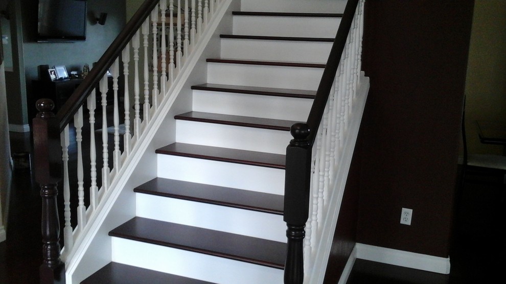 Design ideas for a classic wood staircase in Portland with painted wood risers.