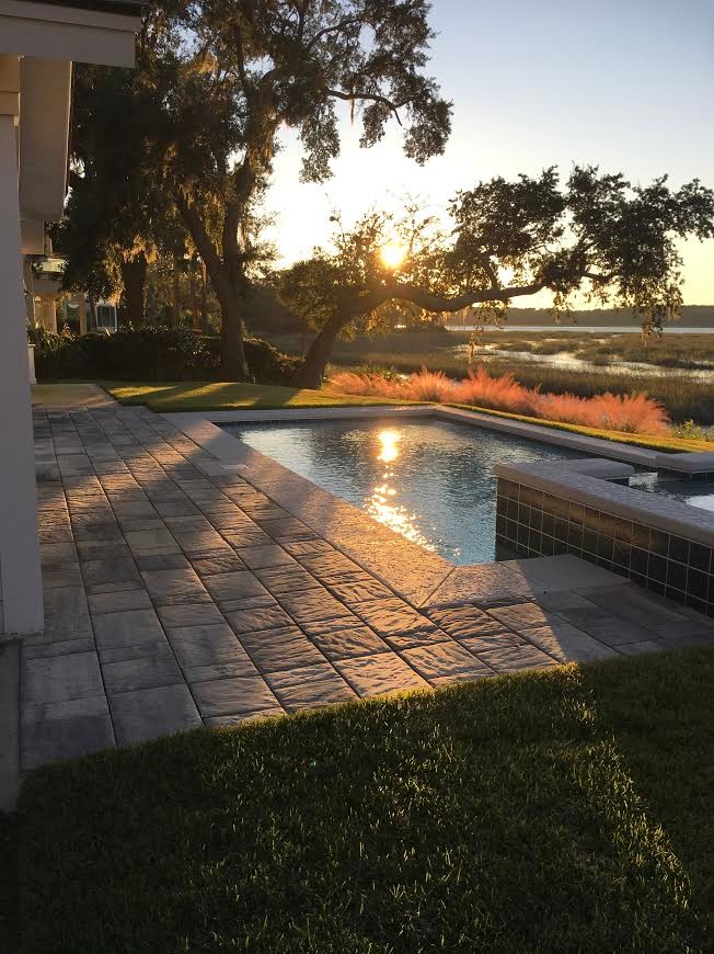 Mid-sized transitional backyard stamped concrete and rectangular lap hot tub photo